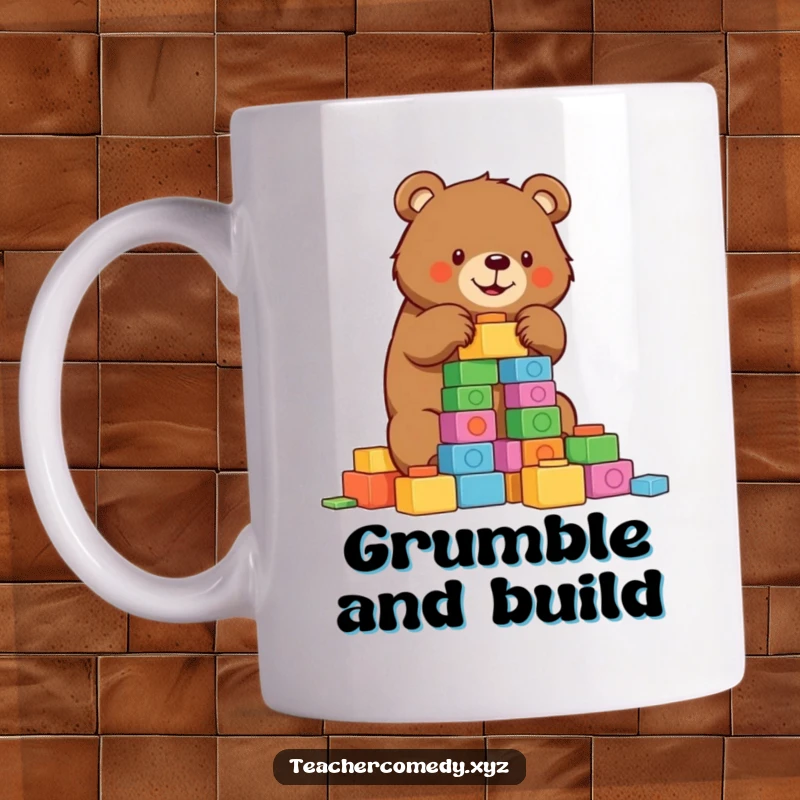 Funny bear mug depicting a determined brown bear carefully stacking colorful building blocks to create a tall tower.