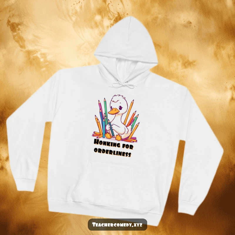 Funny, cozy hoodie featuring a focused goose meticulously organizing colorful pencils, offering warm, humorous organizational pride.