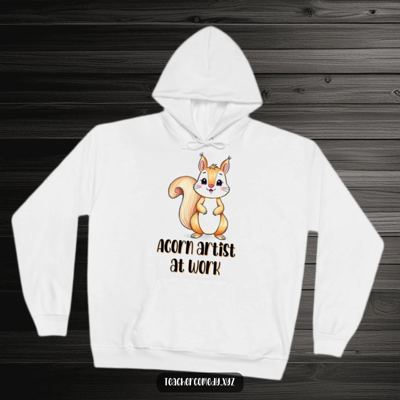 Funny, cozy hoodie featuring a playful squirrel engrossed in drawing with a crayon, offering warm, humorous artistic inspiration.
