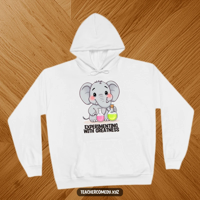 Funny hoodie with a smiling elephant character dressed as a scientist, expertly handling a flask for an experiment.